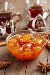 White cherry jam in bowl on wooden background