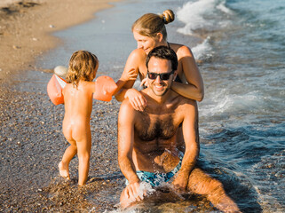 Family having fun on beach
