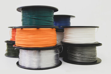 3D Printer Filament, TPU Filament,, Row of spool filament for 3d printing, isolated on white...