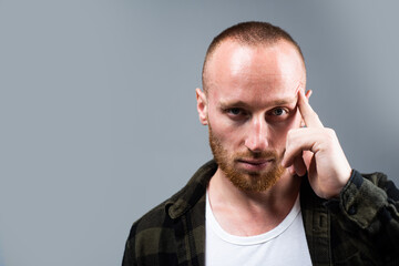 Portrait of stylish handsome young man. Thought thinking guy.