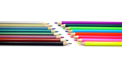 colored pencils lie opposite each other on a white background, isolated, close-up, macro