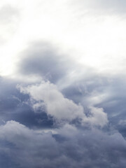 Fototapeta na wymiar Gray dramatic sky with rain clouds, vertical format
