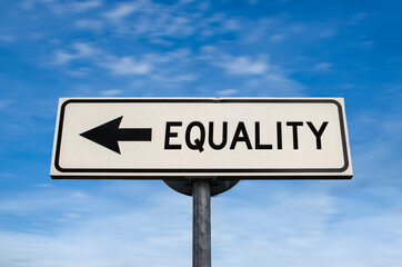 Equality road sign, arrow on blue sky background. One way blank road sign with copy space. Arrow on a pole pointing in one direction.