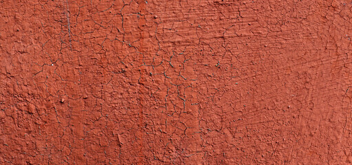 Fototapeta premium Old cracked red paint on board surface