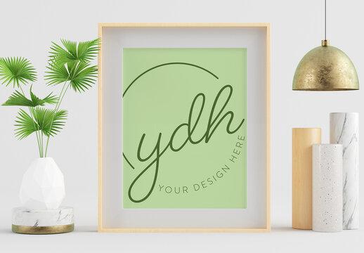 Wooden Frame Mockup with Lamp, Plant and Surreal Artwork