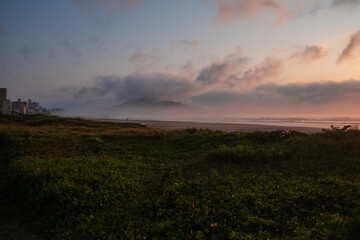 sunset on the beach colorful clouds  and mountain 