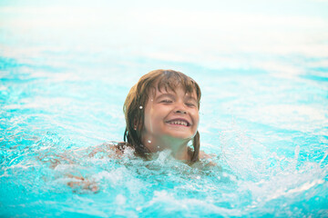 Happy kids boy swim in the sea. Funny little swimmer.