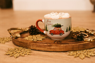 Christmas and New Year decor. Cup with hot chocolate stand on a table