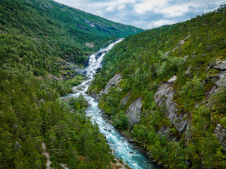 Fototapeta na wymiar Nyastolfossen falls, second in cascade of four waterfalls in Husedalen valley, Kinsarvik, Norway