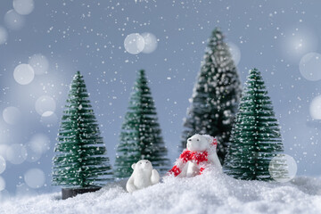 Cute white bears on snow in the forest at Christmas night