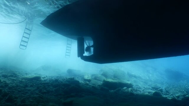 propeller of a boat parking working turning underwater danger for scuba divers
