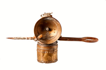 Vintage miner's lamp isolated on white.