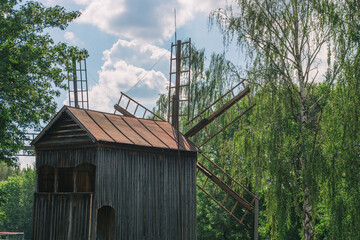 Fototapeta na wymiar Old wooden mills surrounded by nature