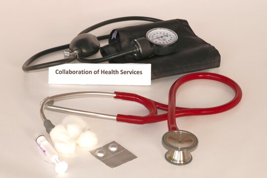 Health Care Concept highlighting the need to integrate collaboration of health care services essential to designing an improved public health care system. Still life photo displays health care instrum
