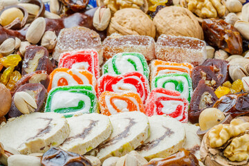 Food background with assorted traditional oriental turkish delights and nuts