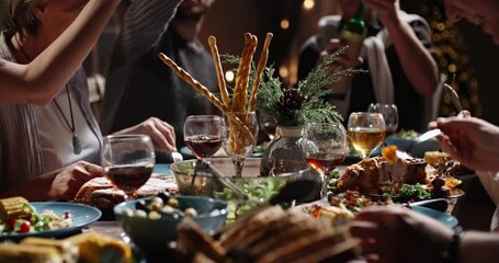 Happy members of large caucasian family toasting to a wish, clinking their glasses during christmas family gathering and dinner xmas party - real people, celebration concept 4k footage - Powered by Adobe