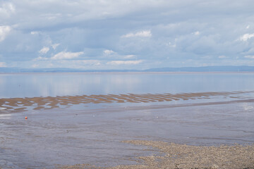 Panoramic photo from Clevedon coast looking out over the Severn in somerset against a blue sky