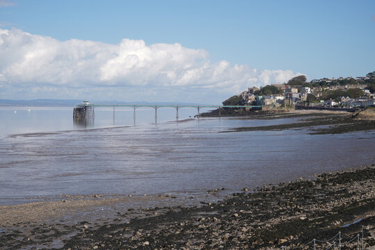 Panoramic photo of Clevedon Pier in somerset showing iron structure against blue sky
