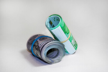 Money roll dollars and euros isolated on the white background