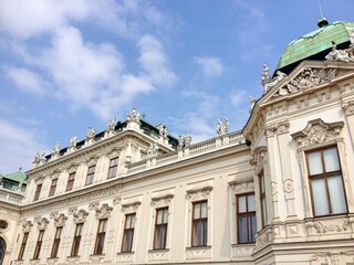 Fototapeta na wymiar Belvedere Vienna Austria. Low angle shot of the exterior of Belvedere baroque palace against blue sky. The palace dated back to 18th century.