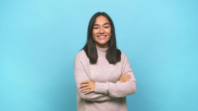 Young mixed race indian woman who feels confident, crossing arms with determination