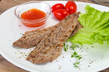 Grilled Thick pork steak served salad