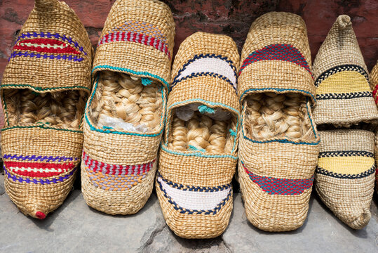 Traditional nepali straw sandals on the floor