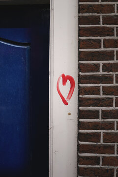 Red heart on doorpost