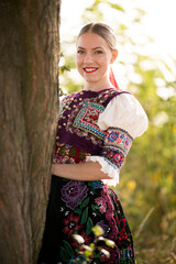Young beautiful slovak woman in traditional costume. Slovak folklore.
