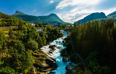 View of the river Geirangerelvi and the waterfall Storfossen in Geiranger, Norway.