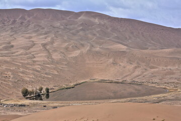 Fototapeta na wymiar Lake Tamaying among sand dunes-Badain Jaran Desert. Alxa Plateau-Inner Mongolia-China-1063