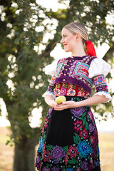 Young beautiful slovak woman in traditional costume. Slovak folklore.