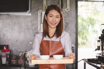 Startup new business concept. Portrait of Asian female working in her coffee shop