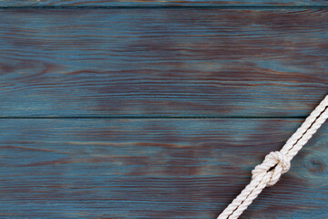 Wooden blue surface with a knot. Background.