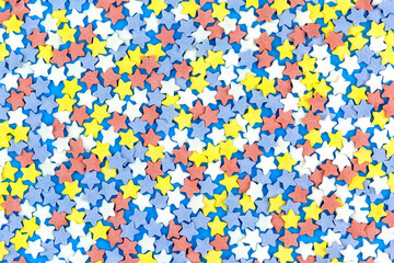 The background is made up of lots of colorful little stars.