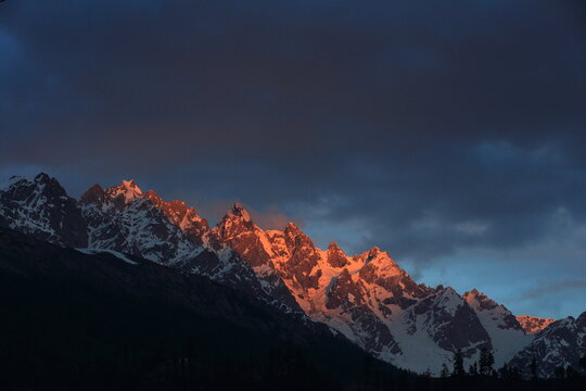 Sunset at snow covered mountains
