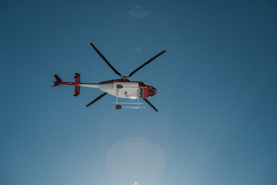 Looking up at a helicopter flying overhead