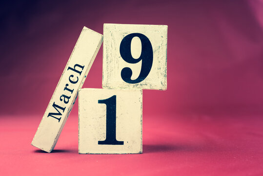 March 19th, Nineteenth of March, Day 19 of month March - vintage wooden calendar blocks on maroon background with empty space for text