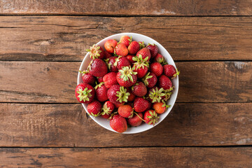 Overhead shot of organic strawberries in bowl