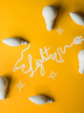 word light written with light bulbs around it.