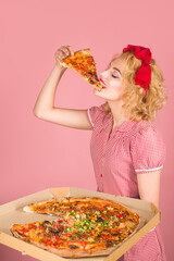 Pin-up girl eats cheese pizza holding a box in one hand. Diet, health, fast food, snacks, lunch.