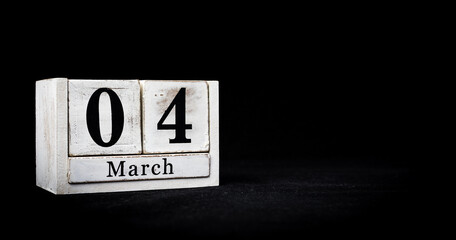 March 4th, Fourth of March, Day 4 of month March - white calendar blocks on black textured background with empty space for text.