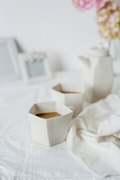 Artistic mugs with coffee