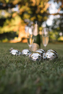 French boules and champagne on a lawn