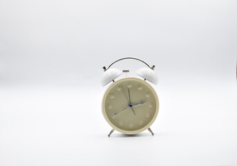 Antique clock in white color and with white background