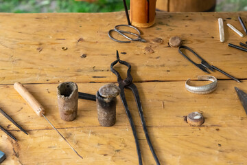 medieval jeweler tool kit form for metal casting, blacksmith's tongs