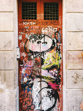 Mobile phone capture of a grafitti door in an alleyway