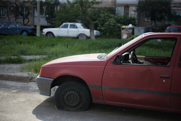 Old wrecked abandoned car after an accident in the city