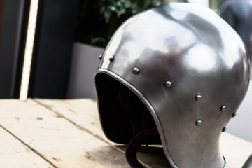 iron forged and light helmet for infantry close-up stands on the table