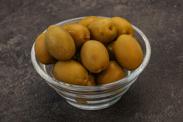 Green pickled olives in the bowl